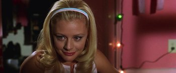 Movie still from “Legally Blonde” (2001), directed by Robert Luketic – A woman with blonde hair wearing a blue headband; Close Up shot, Low angle