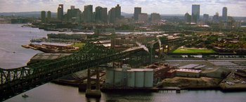 Movie still from “Legally Blonde” (2001), directed by Robert Luketic – An aerial view of a river with a bridge and a city in the background; Extreme Wide shot, High angle