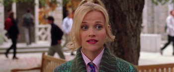 Movie still from “Legally Blonde” (2001), directed by Robert Luketic – A person wearing a suit and tie; Close Up shot, Over the shoulder angle
