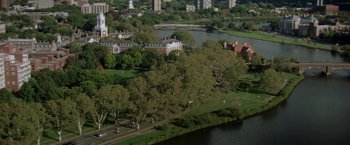 Movie still from “Legally Blonde” (2001), directed by Robert Luketic – An aerial view of a park with a lake and buildings in the background; Extreme Wide shot, High angle