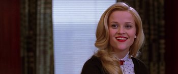 Movie still from “Legally Blonde” (2001), directed by Robert Luketic – A woman with long blonde hair and a red bow tie; Close Up shot, Low angle