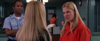 Movie still from “Legally Blonde” (2001), directed by Robert Luketic – Two women are talking in an office setting; Close Up shot, Over the shoulder angle