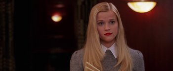 Movie still from “Legally Blonde” (2001), directed by Robert Luketic – A woman with long blonde hair wearing a sweater; Close Up shot, Over the shoulder angle