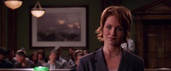 Movie still from “Legally Blonde” (2001), directed by Robert Luketic – A woman in a room with people; Close Up shot, Over the shoulder angle