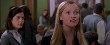 Movie still from “Legally Blonde” (2001), directed by Robert Luketic – A person with long blonde hair; Close Up shot, Over the shoulder angle