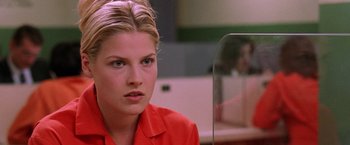 Movie still from “Legally Blonde” (2001), directed by Robert Luketic – A woman in a red shirt looking at a mirror; Close Up shot, Low angle