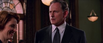 Movie still from “Legally Blonde” (2001), directed by Robert Luketic – A man in a black suit and a white shirt; Close Up shot, Over the shoulder angle