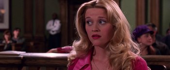Movie still from “Legally Blonde” (2001), directed by Robert Luketic – A person with long blonde hair; Close Up shot, Over the shoulder angle
