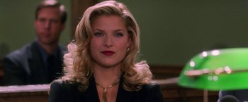 Movie still from “Legally Blonde” (2001), directed by Robert Luketic – A person with blonde hair wearing a suit; Close Up shot, High angle
