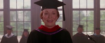 Movie still from “Legally Blonde” (2001), directed by Robert Luketic – An older woman wearing a graduation cap and gown; Close Up shot, Low angle