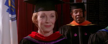 Movie still from “Legally Blonde” (2001), directed by Robert Luketic – A woman wearing a graduation cap and gown; Close Up shot, Over the shoulder angle