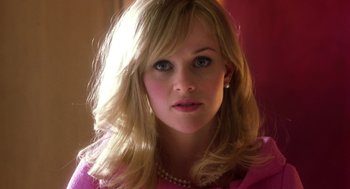 Movie still from “Legally Blonde 2: Red, White & Blonde” (2003), directed by Charles Herman-Wurmfeld – A person wearing a pink shirt; Close Up shot, Low angle