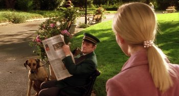 Movie still from “Legally Blonde 2: Red, White & Blonde” (2003), directed by Charles Herman-Wurmfeld – A man sitting in a chair reading a newspaper; Medium shot, Over the shoulder angle