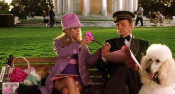 Movie still from “Legally Blonde 2: Red, White & Blonde” (2003), directed by Charles Herman-Wurmfeld – A man and a woman sitting on a park bench; Medium shot, Low angle