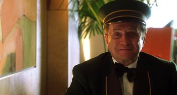 Movie still from “Legally Blonde 2: Red, White & Blonde” (2003), directed by Charles Herman-Wurmfeld – An older man wearing a hat and a tie; Close Up shot, Low angle