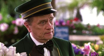 Movie still from “Legally Blonde 2: Red, White & Blonde” (2003), directed by Charles Herman-Wurmfeld – An older man wearing a hat and a bow tie; Close Up shot, Low angle