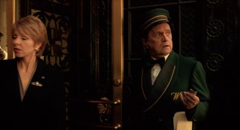 Movie still from “Legally Blonde 2: Red, White & Blonde” (2003), directed by Charles Herman-Wurmfeld – A man in a green uniform standing in front of a door; Medium shot, Low angle
