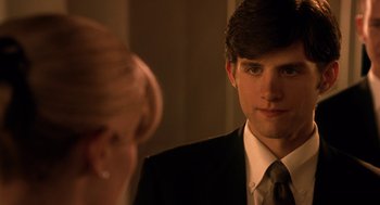 Movie still from “Legally Blonde 2: Red, White & Blonde” (2003), directed by Charles Herman-Wurmfeld – A man in a suit and tie looking at a woman in a dress; Close Up shot, Over the shoulder angle