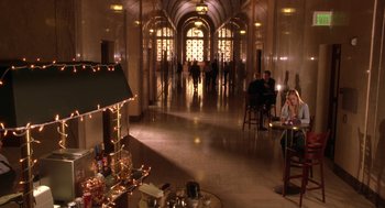 Movie still from “Legally Blonde 2: Red, White & Blonde” (2003), directed by Charles Herman-Wurmfeld – People are sitting in a lobby of a building; Extreme Wide shot, High angle