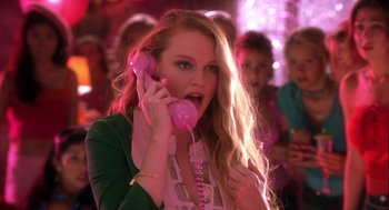 Movie still from “Legally Blonde 2: Red, White & Blonde” (2003), directed by Charles Herman-Wurmfeld – A woman holding a pink phone up to her ear; Medium shot, Low angle