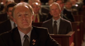 Movie still from “Legally Blonde 2: Red, White & Blonde” (2003), directed by Charles Herman-Wurmfeld – A person wearing a suit and tie; Close Up shot, Low angle