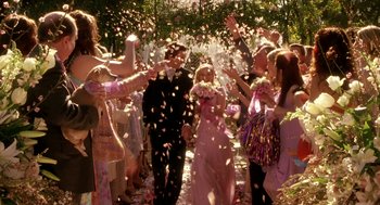 Movie still from “Legally Blonde 2: Red, White & Blonde” (2003), directed by Charles Herman-Wurmfeld – A group of people standing in a forest with confetti; Wide shot, High angle