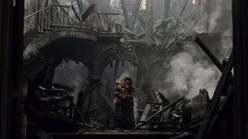 Movie still from “A Series of Unfortunate Events” (2004), directed by Brad Silberling – A couple of people that are standing in a room; Wide shot, High angle