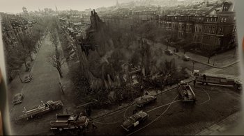 Movie still from “A Series of Unfortunate Events” (2004), directed by Brad Silberling – An aerial view of a fire scene in a city; Extreme Wide shot, High angle