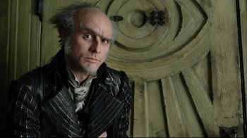 Movie still from “A Series of Unfortunate Events” (2004), directed by Brad Silberling – An old man with a beard and a wig; Close Up shot, Low angle