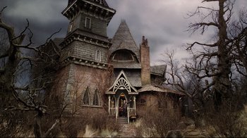 Movie still from “A Series of Unfortunate Events” (2004), directed by Brad Silberling – An old house with a very tall tower in front of it; Wide shot, Low angle