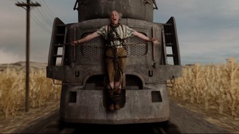 Movie still from “A Series of Unfortunate Events” (2004), directed by Brad Silberling – An old man is standing on the back of an old train; Wide shot, Low angle