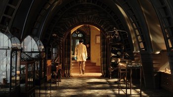 Movie still from “A Series of Unfortunate Events” (2004), directed by Brad Silberling – A man walking down the stairs of a building; Wide shot, Low angle