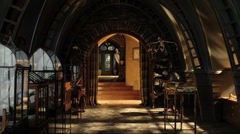 Movie still from “A Series of Unfortunate Events” (2004), directed by Brad Silberling – An arch with stairs leading up to it and a staircase leading to it; Wide shot, High angle