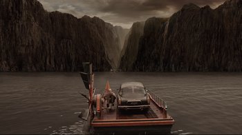 Movie still from “A Series of Unfortunate Events” (2004), directed by Brad Silberling – A boat with a car on it in the middle of a lake; Extreme Wide shot, High angle