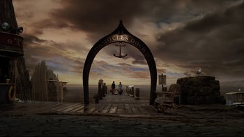 Movie still from “A Series of Unfortunate Events” (2004), directed by Brad Silberling – Two people are standing on a pier under an archway; Extreme Wide shot, High angle