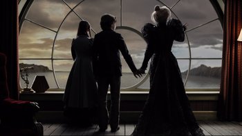 Movie still from “A Series of Unfortunate Events” (2004), directed by Brad Silberling – A group of people standing in front of a window; Medium shot, Over the shoulder angle