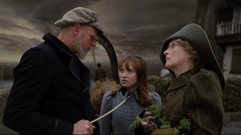 Movie still from “A Series of Unfortunate Events” (2004), directed by Brad Silberling – A group of people standing next to each other; Medium shot, Over the shoulder angle