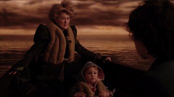 Movie still from “A Series of Unfortunate Events” (2004), directed by Brad Silberling – An older woman and a young child in a boat; Medium shot, Over the shoulder angle