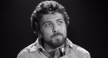 Movie still from “Lenny” (1974), directed by Bob Fosse – Black and white photograph of a man with a beard; Close Up shot, Low angle