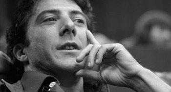 Movie still from “Lenny” (1974), directed by Bob Fosse – Black and white photograph of a man looking up; Close Up shot, Low angle