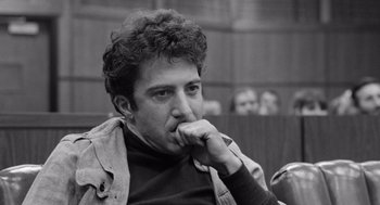 Movie still from “Lenny” (1974), directed by Bob Fosse – Black and white photograph of a man with curly hair; Close Up shot, Low angle
