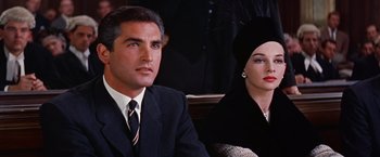 Movie still from “Les Girls” (1957), directed by George Cukor – A man and a woman sitting next to each other; Close Up shot, Low angle