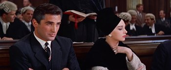 Movie still from “Les Girls” (1957), directed by George Cukor – A man and a woman sitting next to each other; Close Up shot, Over the shoulder angle