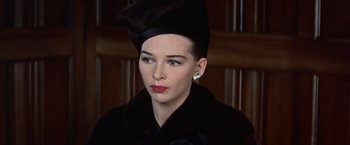 Movie still from “Les Girls” (1957), directed by George Cukor – A person wearing a hat; Close Up shot, High angle