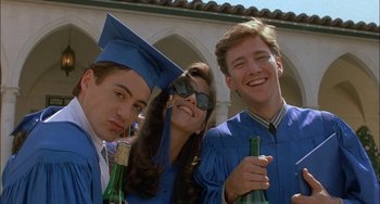 Movie still from “Less Than Zero” (1987), directed by Marek Kanievska – A group of young people standing next to each other; Close Up shot, Low angle