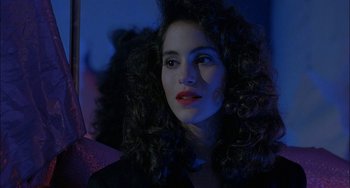 Movie still from “Less Than Zero” (1987), directed by Marek Kanievska – A person with curly brown hair; Close Up shot, Over the shoulder angle