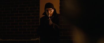 Movie still from “Let Me In” (2010), directed by Matt Reeves – A man dressed as a vampire holding a knife; Medium shot, Low angle