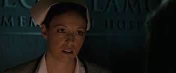 Movie still from “Let Me In” (2010), directed by Matt Reeves – A person wearing a hat; Close Up shot, Over the shoulder angle