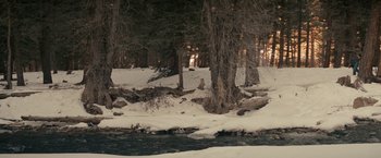 Movie still from “Let Me In” (2010), directed by Matt Reeves – A river running through a forest filled with snow; Extreme Wide shot, High angle
