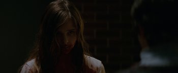 Movie still from “Let Me In” (2010), directed by Matt Reeves – A woman with blood all over her face; Close Up shot, Over the shoulder angle